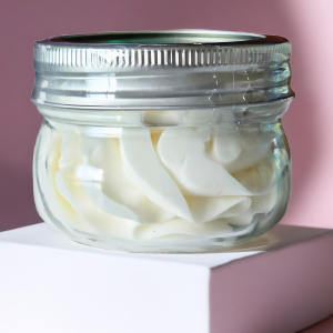Open jar showing creamy whipped texture of Balm of Gilead unscented shea butter body butter
